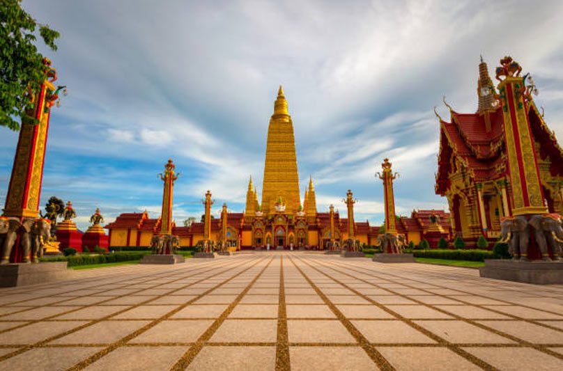 The golden stupa of Wat Bang Thong towering over the forest