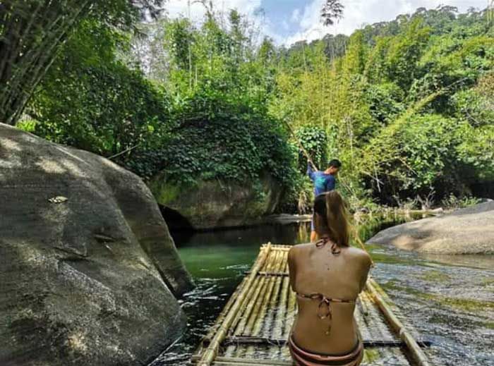 Bamboo rafting through the jungle gorge near Khao Lak